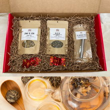 Load image into Gallery viewer, Witchy Pooh&#39;s Gift Box Set with 2-1oz Pouches of Tea, A Spring Action Tea Infuser Stick, 2 Blooming Tea Balls in a Large Red Mailer Box-2
